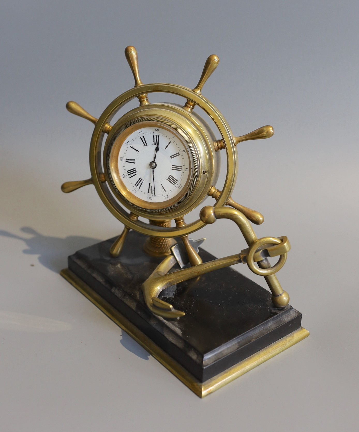 A Victorian brass and black slate nautical themed desk timepiece, width 19cm height 20cm